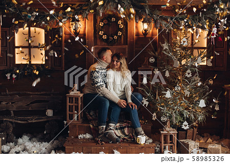 Christmas portrait of a romantic couple wooden Christmas portrait of a romantic couple wooden 58985326