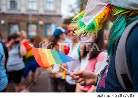 Happy crowd waving lgbt flags during Pride Parade Happy crowd waving lgbt flags during Pride Parade 58987088