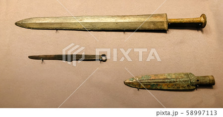 Bronze sword, knife and spear head from Qin Emperor mausoleum museum in Xian, China  58997113