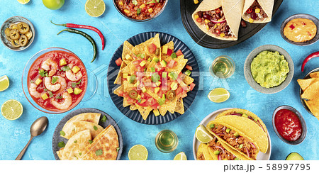 A panorama of Mexican food, many dishes of the cuisine of Mexico, flat lay, top shot on a blue 58997795