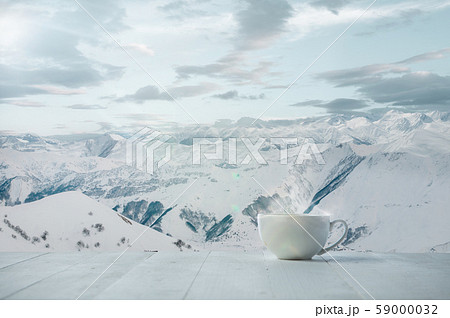 Single tea or coffee mug and landscape of mountains on background 59000032