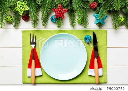 Top view of fork, knife and plate surrounded with Top view of fork, knife and plate surrounded with 59000772