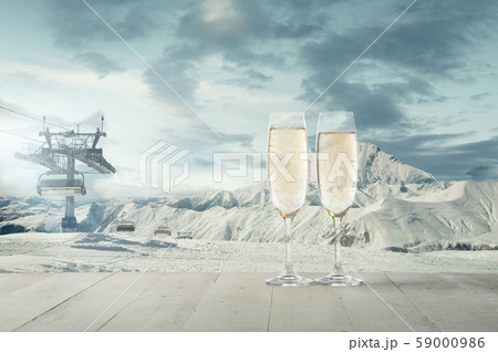 Champagne in glasses and landscape of mountains on background 59000986