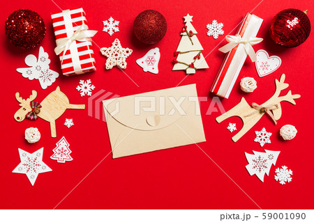 Top view of envelope on red background. New Year Top view of envelope on red background. New Year 59001090