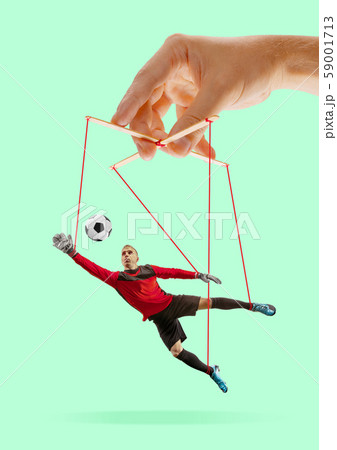 Man like a puppet in somebodies hands. Concept of manipulation Man like a puppet in somebodies hands. Concept of manipulation 59001713