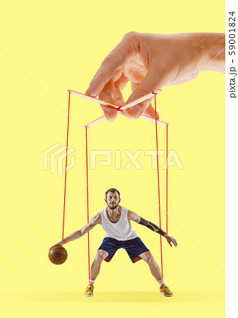 Man like a puppet in somebodies hands. Concept of manipulation Man like a puppet in somebodies hands. Concept of manipulation 59001824