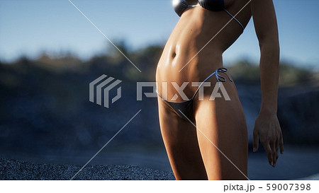 Beautiful Woman in Sexy Bikini near the Rocks Beautiful Woman in Sexy Bikini near the Rocks 59007398