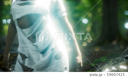 young woman in torn t-shirt in green forest young woman in torn t-shirt in green forest 59007425