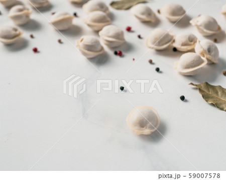 scattered frozen pelmeni top view, copy space scattered frozen pelmeni top view, copy space 59007578