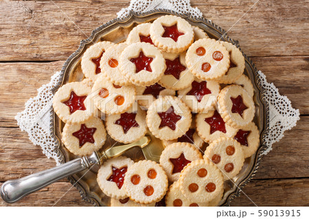 Linzer cookies with jam on a plate. Traditional 59013915