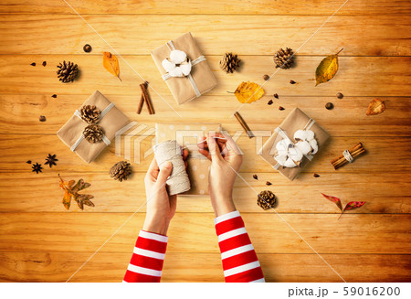 Person making present boxes Person making present boxes 59016200