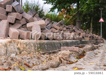 Road repair. Paving slabs. Building material for the road. Road repair. Paving slabs. Building material for the road. 59018861