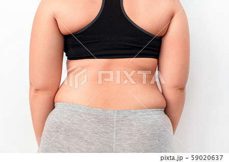 Body Care. Chubby girl standing isolated on white showing back close-up 59020637