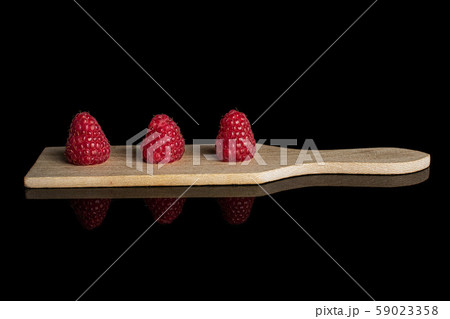 Fresh red raspberry isolated on black glass Fresh red raspberry isolated on black glass 59023358