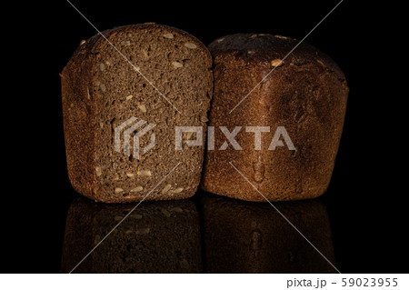 Fresh baked dark bread isolated on black glass Fresh baked dark bread isolated on black glass 59023955