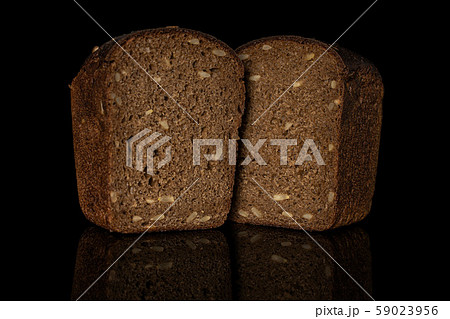Fresh baked dark bread isolated on black glass 59023956