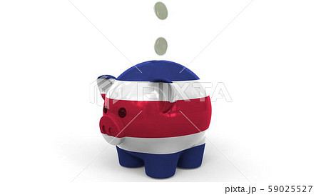 Coins fall into piggy bank painted with flag of Costa Rica. National banking system or savings 59025527