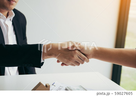 Home sales agents and buyers work on signing new 59027605