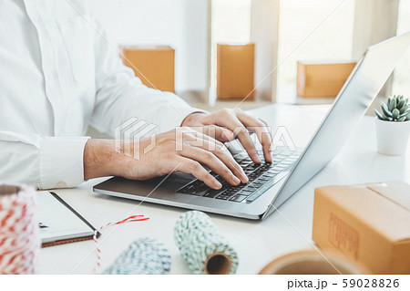 SME freelance man working with packaging startup 59028826