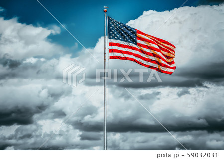 Star-striped American flag flutters proudly 59032031