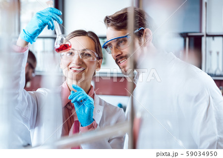 Two chemical scientists during breakthrough experiment Two chemical scientists during breakthrough experiment 59034950
