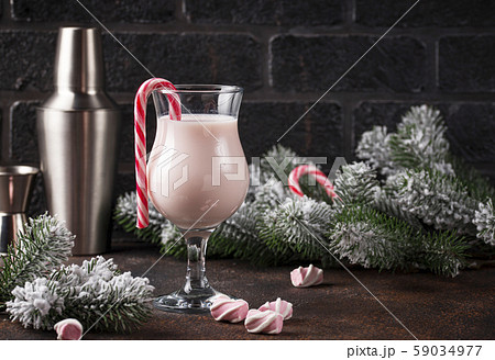 Pink Christmas cocktail with marshmallow 59034977