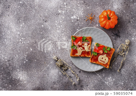 Halloween sandwiches toasts with ghost and pumpkin 59035074