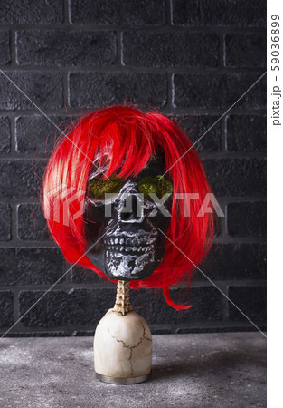 Human skull with red wig Human skull with red wig 59036899