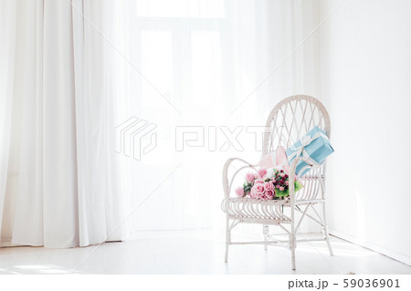 white vintage chair in the interior of an empty white room white vintage chair in the interior of an empty white room 59036901