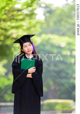 Happy cute asian students graduated holding diplomas Happy cute asian students graduated holding diplomas 59037613