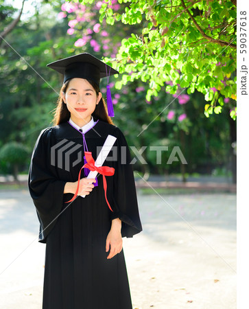 Pretty asian female college graduate at graduation Pretty asian female college graduate at graduation 59037618
