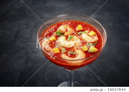 Coctel de gambas, Mexican shrimp cocktail with avocado, close-up on a black background Coctel de gambas, Mexican shrimp cocktail with avocado, close-up on a black background 59037644