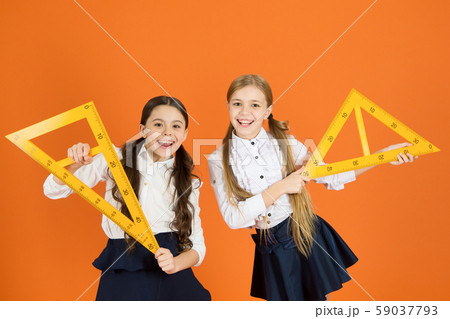 Kids school uniform on orange background. Pupil 59037793