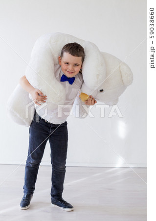 Beautiful boy with toy big polar bear Beautiful boy with toy big polar bear 59038660