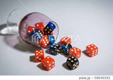 The red and blue dice lie on a white background 59040393