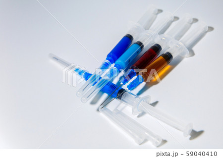The concept of medical injections for cosmetology and new invented drugs. Set of medical syringes with injections. 59040410