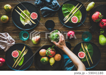 Autumn table styling for holiday and female hands Autumn table styling for holiday and female hands 59041180