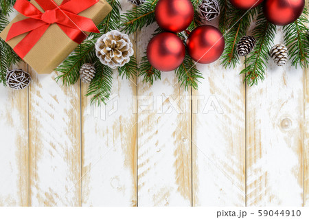 Christmas decorations, gift box and red balls on a 59044910