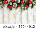 Christmas decorations, red balls and pine cones on 59044912