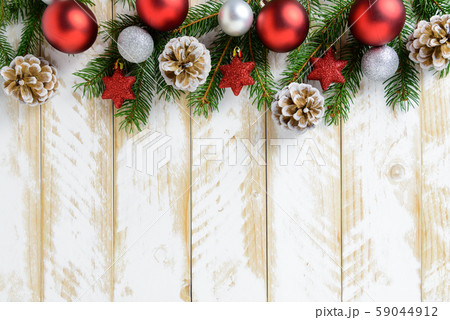 Christmas decorations, red balls and pine cones on 59044912