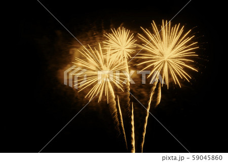 Golden fireworks on a black background 59045860