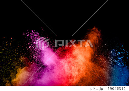 Abstract multicolored powder explosion on black background.Colorful dust particles splatter on background. Abstract multicolored powder explosion on black background.Colorful dust particles splatter on background. 59046312