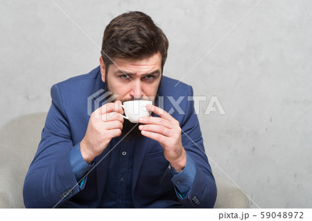Coffee can do it best. Businessman drinking coffee 59048972