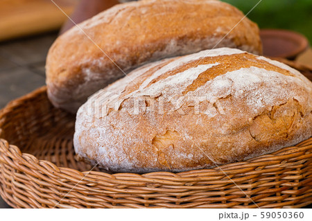 pair fresh baked bread rustic closeup wicker 59050360