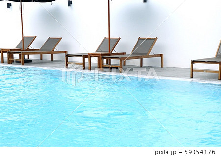 Chair loungers by the pool 59054176