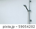 Shower head beside the pool 59054202