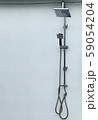 Shower head beside the pool 59054204