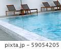 Chair loungers by the pool 59054205