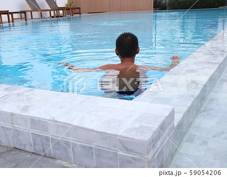 boy swimming in the pool 59054206