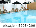 Chair loungers by the pool 59054209